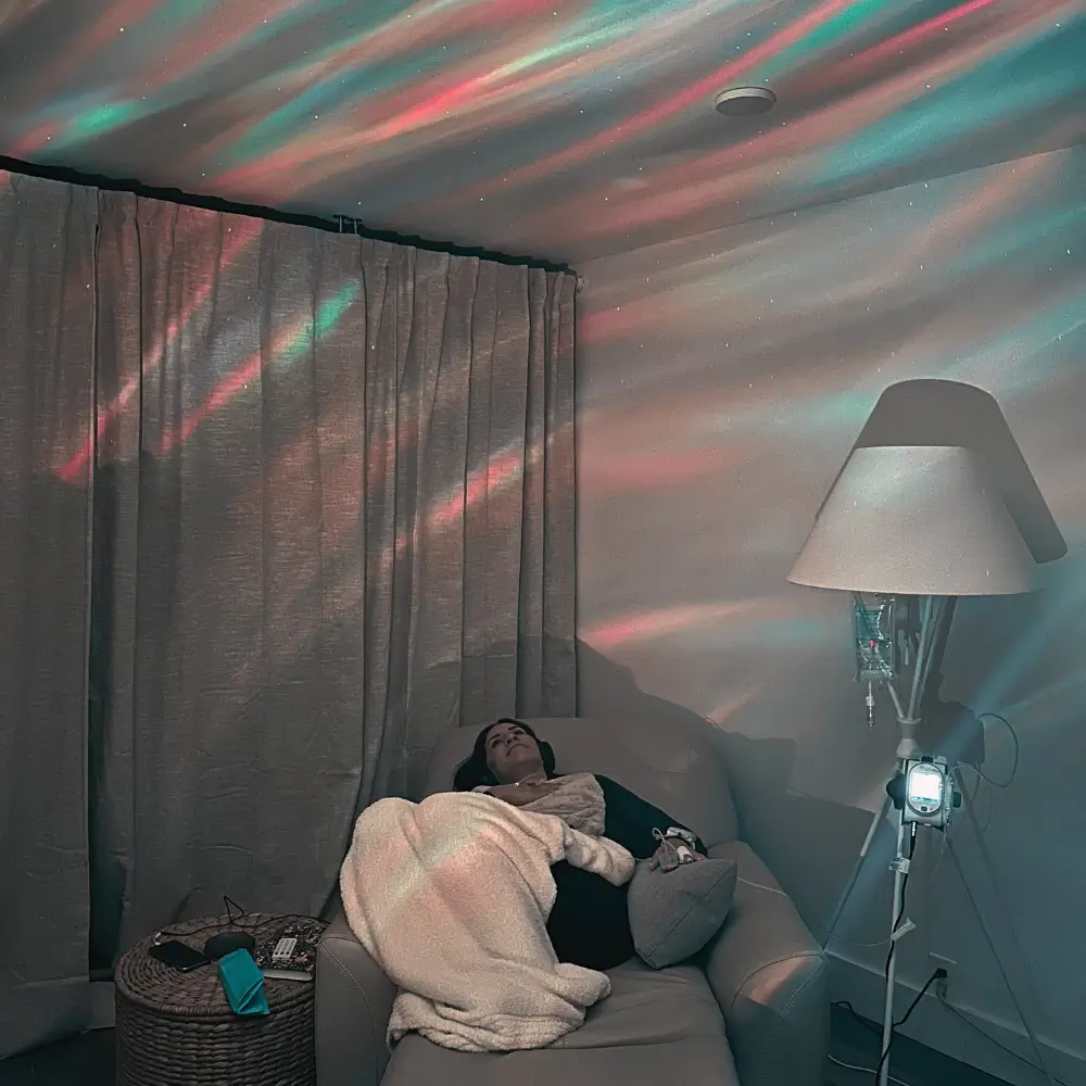 Dr. Alexandra Jabr lying in a dim room receiving Ketamine therapy for ems ptsd
